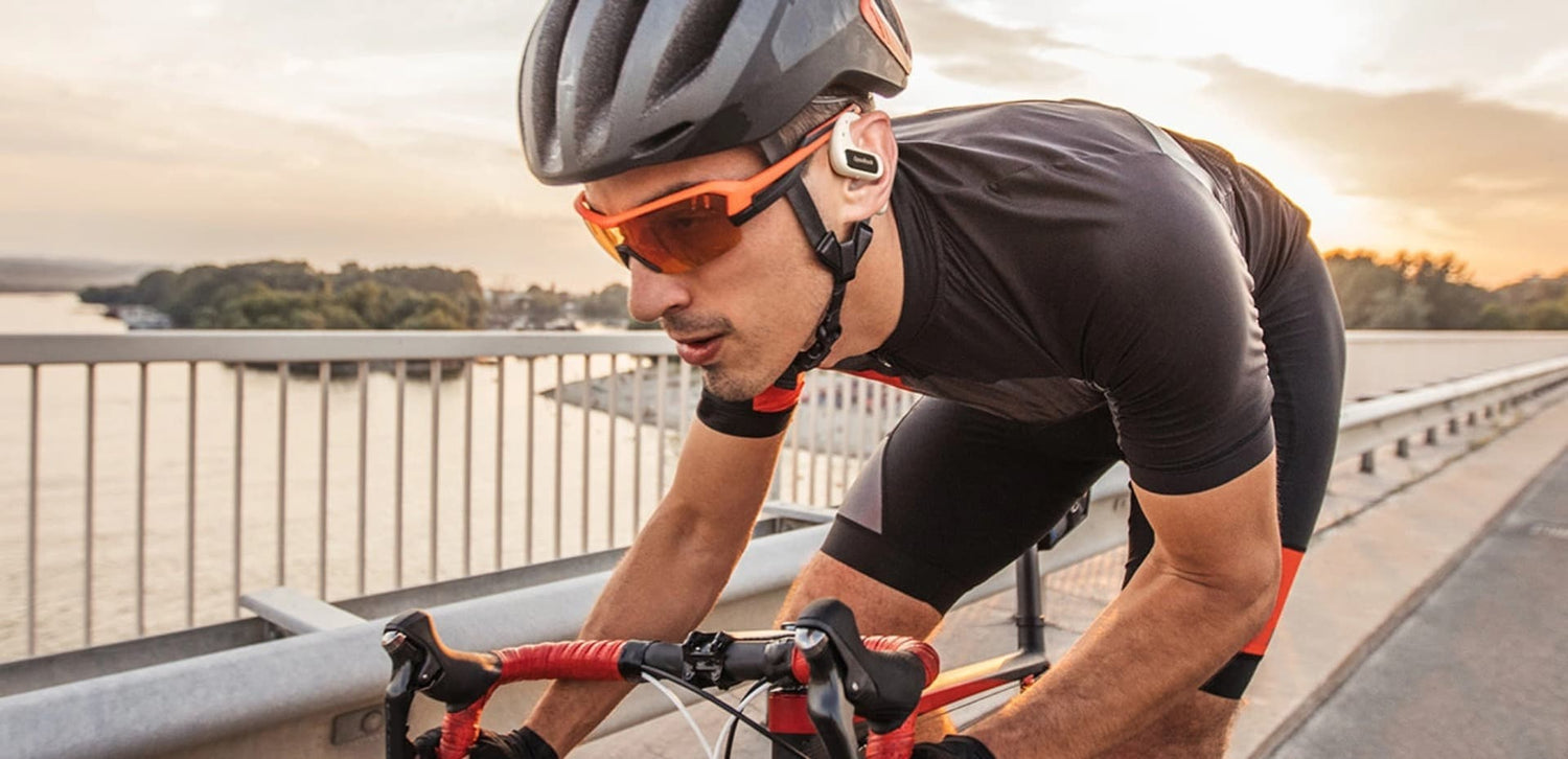 riding sporting with openrock pro open-ear earbuds