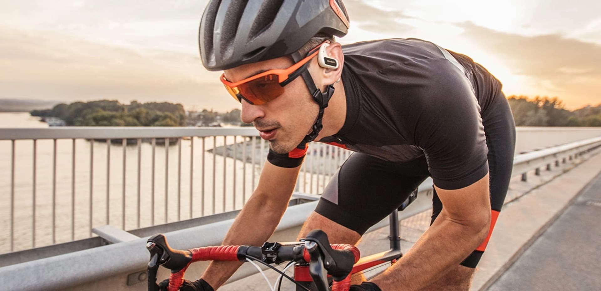 riding sporting with openrock pro open-ear earbuds